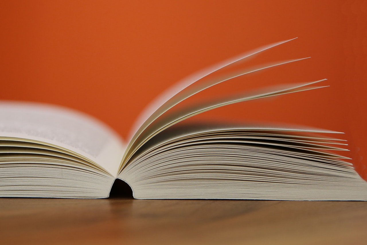 an open book on a wooden table